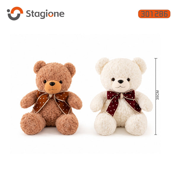 Orso di peluche riccio con fiocco a pois