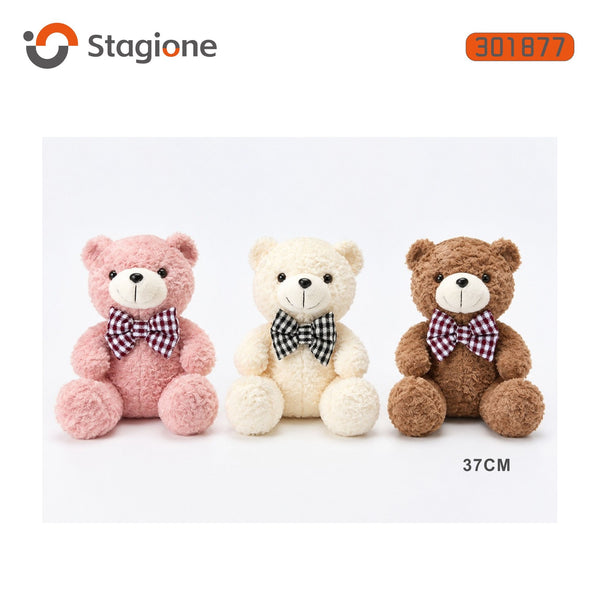 Orso di peluche seduto con fiocco